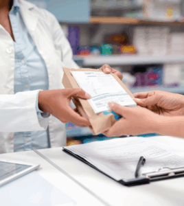 doctor handing patient a prescription