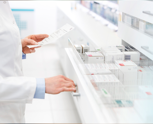 pharmacist reading prescription