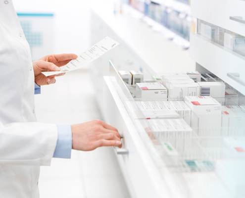 pharmacist reading prescription