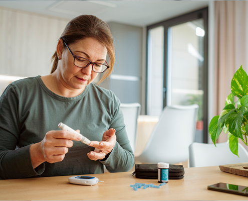Woman with glucose monitor