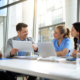 Business benefits professionals reviewing pharmacy benefit options and partnership requirements for employer health plans.