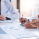 Benefits and implementation teams reviewing a PBM transition plan, data requirements and go-live responsibilities before an employer pharmacy benefit launch.