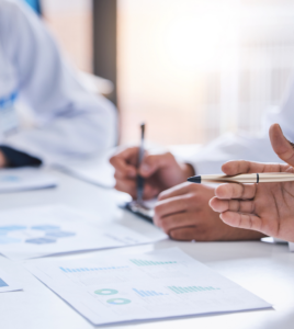 Benefits and implementation teams reviewing a PBM transition plan, data requirements and go-live responsibilities before an employer pharmacy benefit launch.